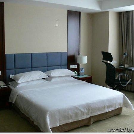 New Land Business Hotel Wuhan Camera foto